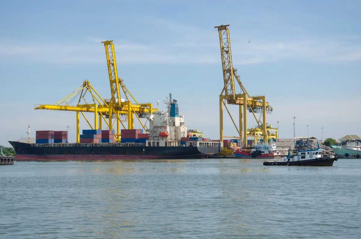 A container ship loading at port